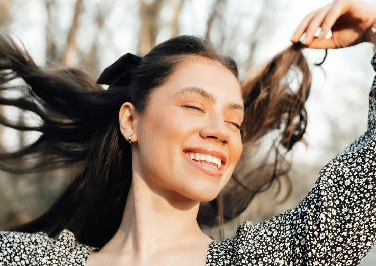 happy woman Mindful Living: Incorporating Anxiety Relief Gummies into Your Wellness Routine
